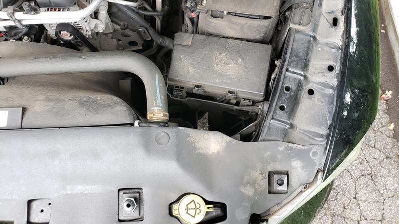 Mounted in the drivers side engine bay - found an empty spot near the fuses (right of the hose).