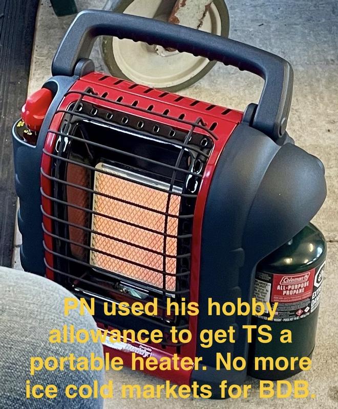 The buddy providing relief to an intrepid knitter.