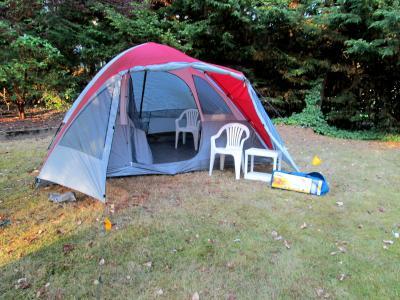 It says it holds 8 people, but for comfort it holds our bed on one side and room to keep our things on the other side.