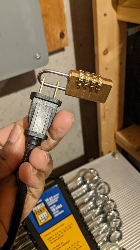 Padlock installed on the power cord