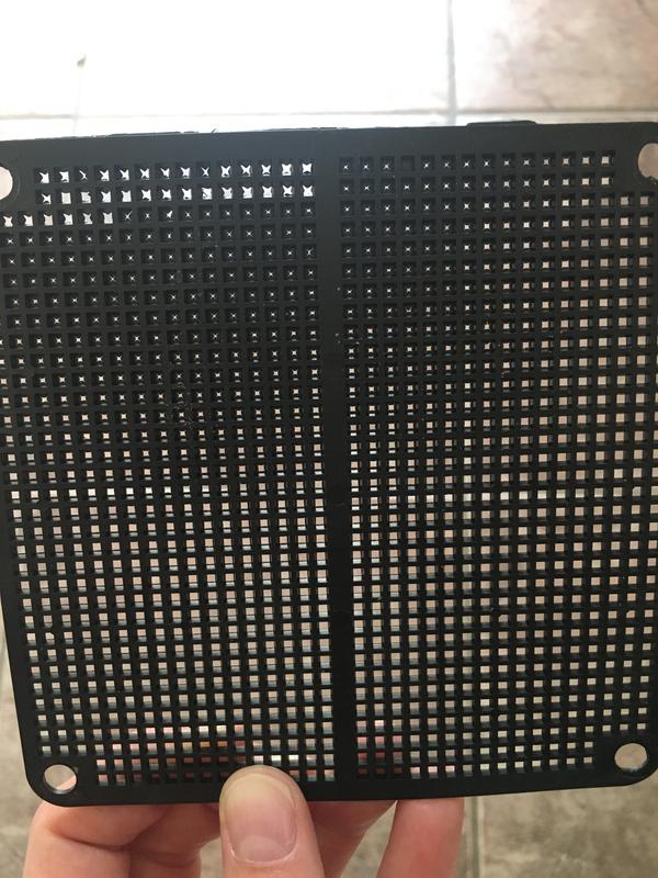 Shows how the holes in the screen were not punched all the way through. You can see where I started punching them in the top left corner.