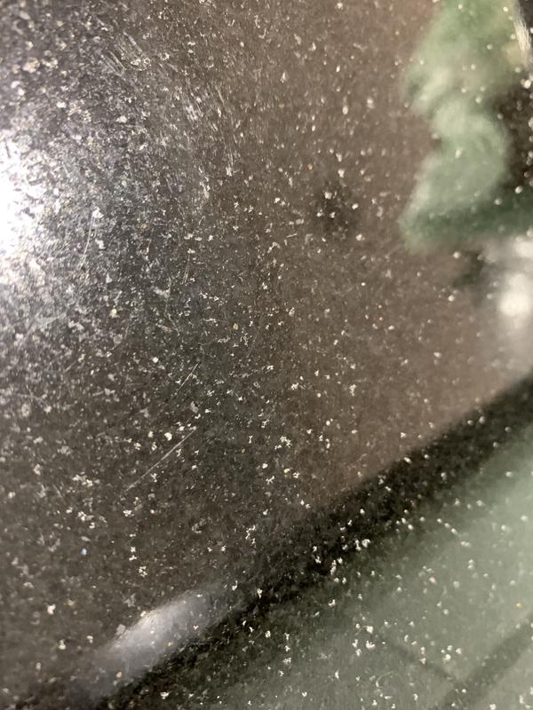 Particles shed by drying mat