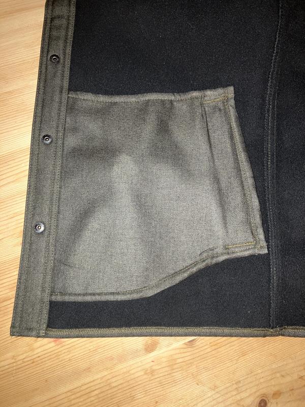 Pic of outside hand pocket on inside of shirt. It's not attached at the top or bottom.