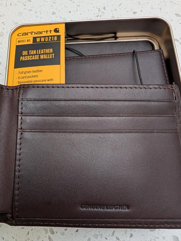 The wallet is stamped "Genuine Leather" but the packaging calls it "Full grain leather".
