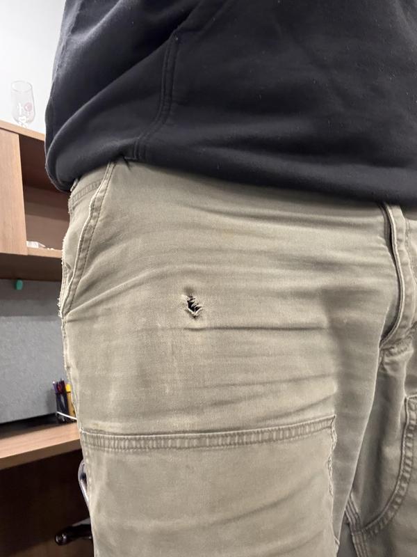 Hole above double front due to rubbing on cell phone in pocket.