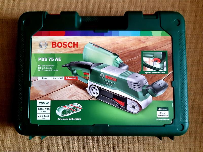 Bosch Home and Garden Ponceuse à bande Bosch PBS 75 AE set (750 W, vitesse  de la bande 200-350 m/min, surface de ponçage 165x76 mm, dans le boîtier) :  : Bricolage
