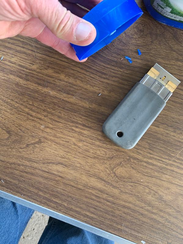 After many unsucessful squeeze attempts, I sliced tabs offf with a razer and finally was able to remove the top.