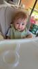 Very happy boy in his new high chair