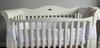 Style of cot and two gaps at the front.