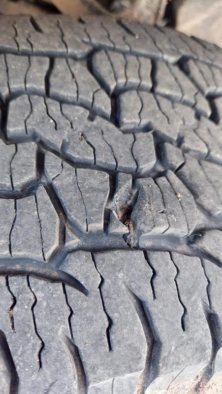 Tire split two directions from gravel in the middle of the lug.