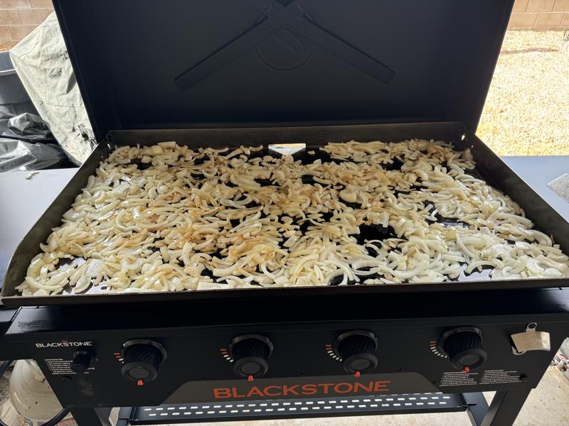 Grilling onions to continue the seasoning process!