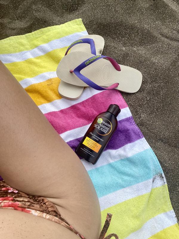 Praia com o meu bronzeador Garnier