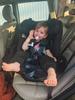 Little poser in her comfortable seat