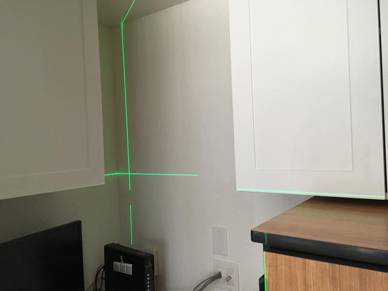 Perfect for hanging cabinets in a big closet--the lower cabs to the right are due to the ceiling not being totally flat, and we couldn't come down because that brown cabinet needs to roll out over a raised bifold door track.