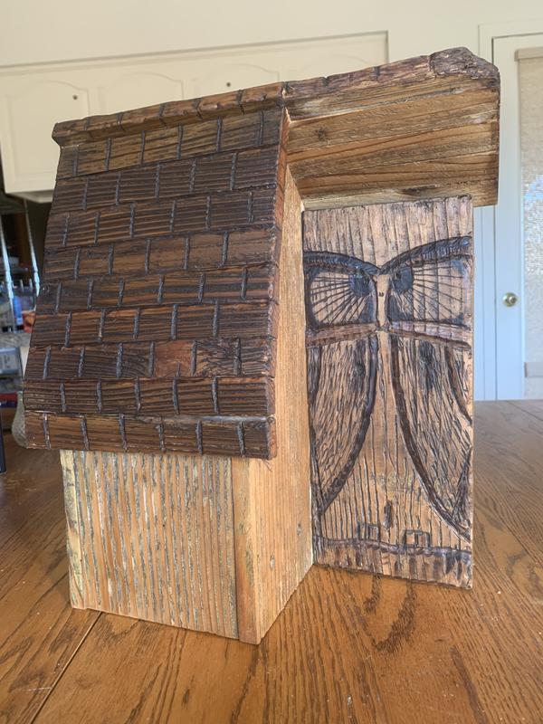 Birdhouse with carved owl