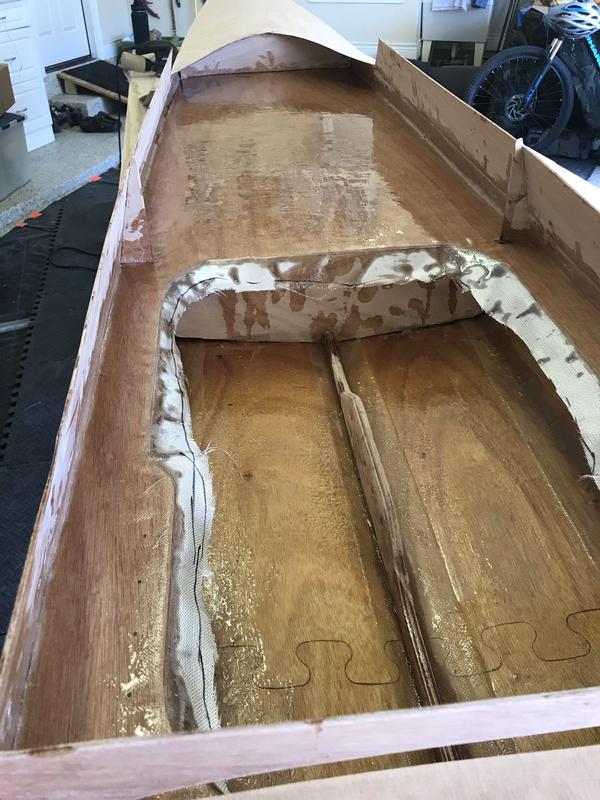 Keel stiffener has holes to attach foot stretcher. Used tool to remove excess epoxy.