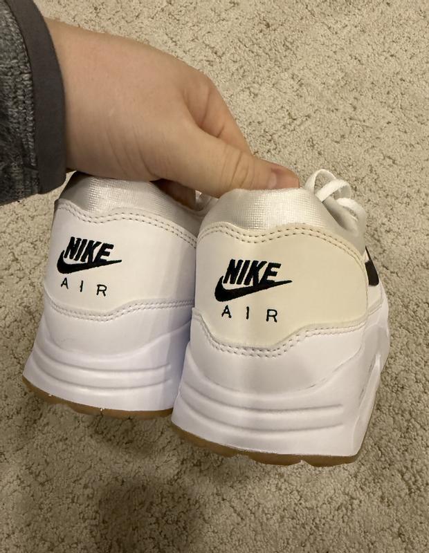 One heel is white, the other heel is creame/off-white