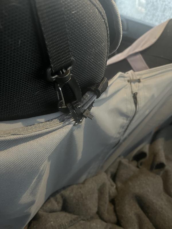 Broken grommet loop, repaired with zip tie.