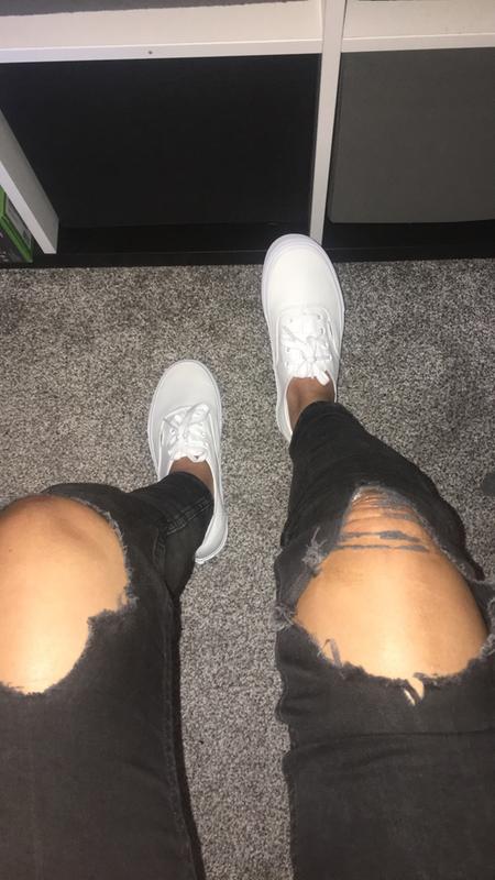 white vans on feet