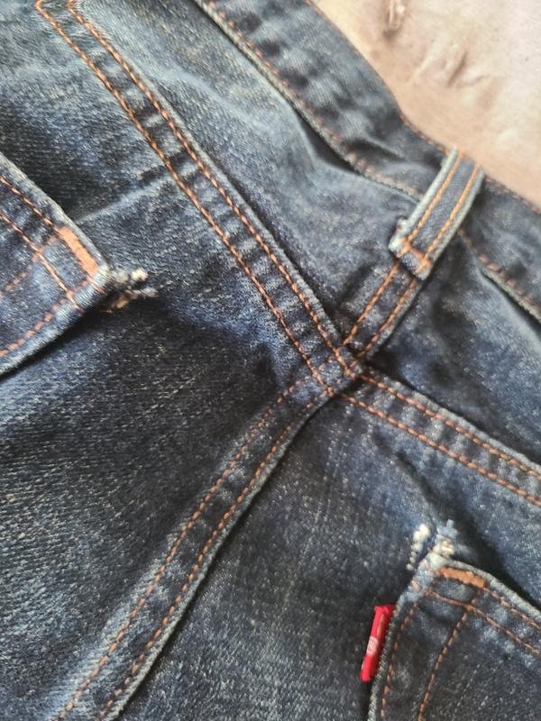 Holes in both back pockets
