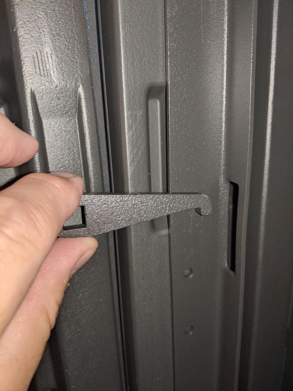 If installed, this brace and latch would not meet.