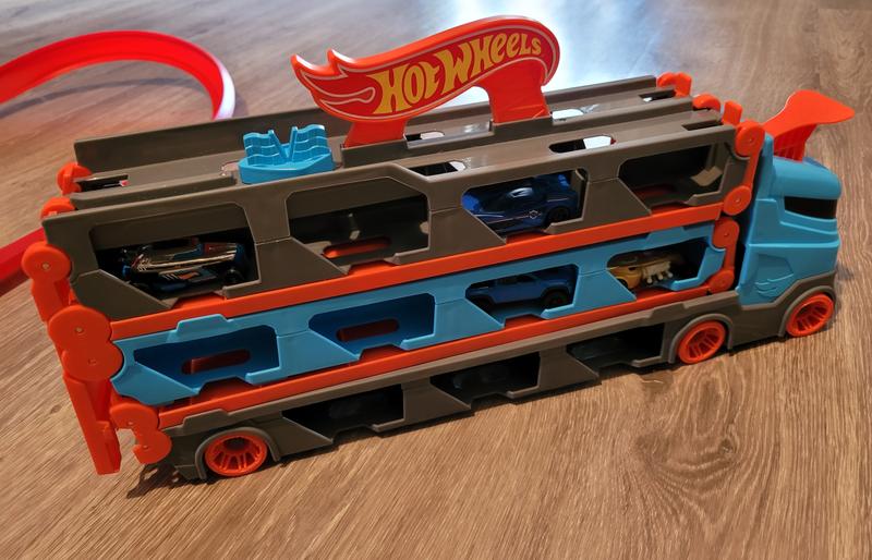 Hot Wheels 2-in-1 Rennbahn-Transporter zur Aufbewahrung mit 3 Fahrzeugen im  Maßstab 1:64 für Kinder von 4 bis 8 Jahren