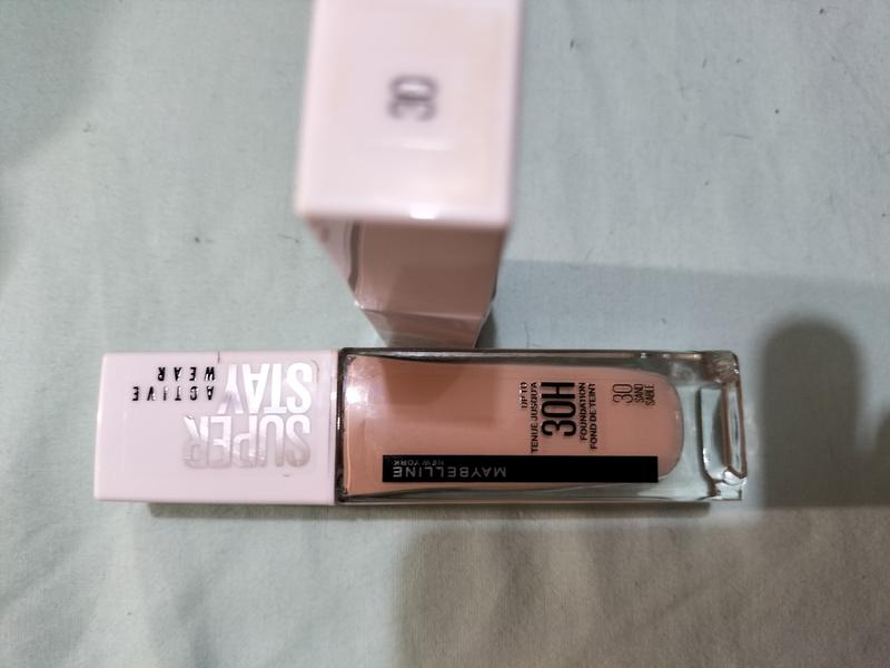 Showing both bottles being labelled Shade 30