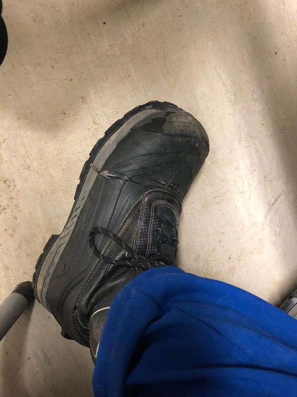 Hole on outer side of left boot