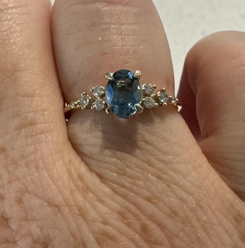 Ring with Blue Topaz and 0.12 Carat TW of Diamonds in 10kt Yellow Gold