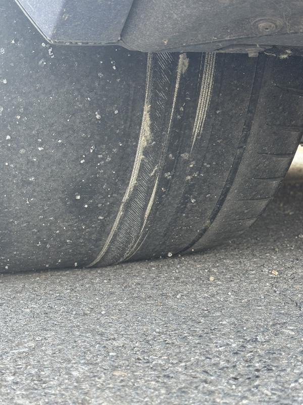 Left rear tire with picture taken at the time the right rear tire blew out.