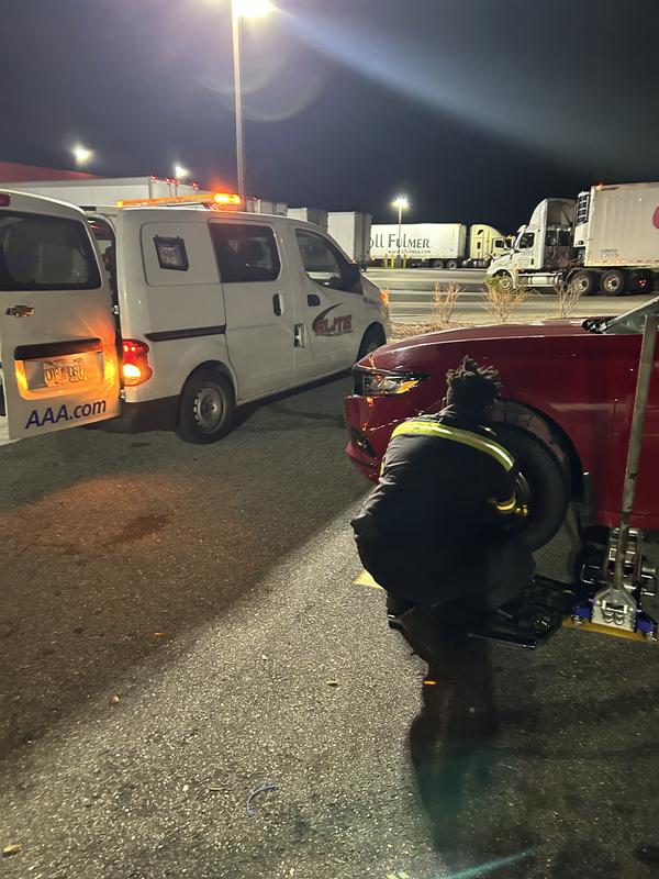 Changing flat tire in the road.