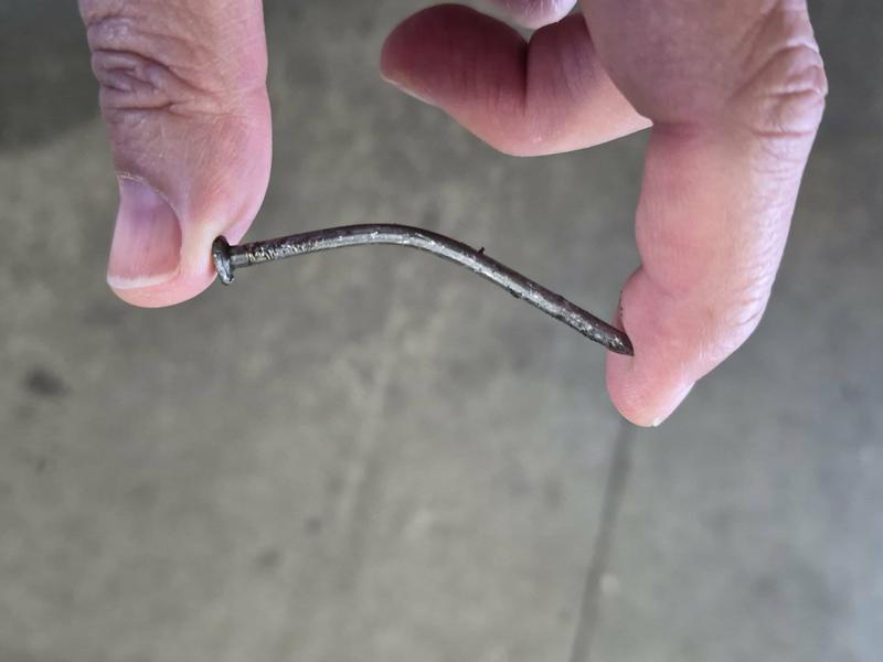 punctured new tire, self seal fail, nail bellow the bend buried in the self-seal which didn't seal. You can see the line of the nail in the self-sealant which for some reason didn't seal it, the self-seal looks not to have been breached.