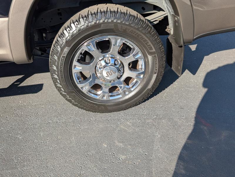 This is the tire before the 3/4 inch bolt got wedged in the new tread design