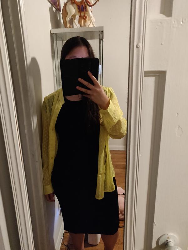 Decent black dress. A little bit fitting to body.