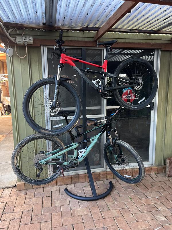 Gravity stand store bike