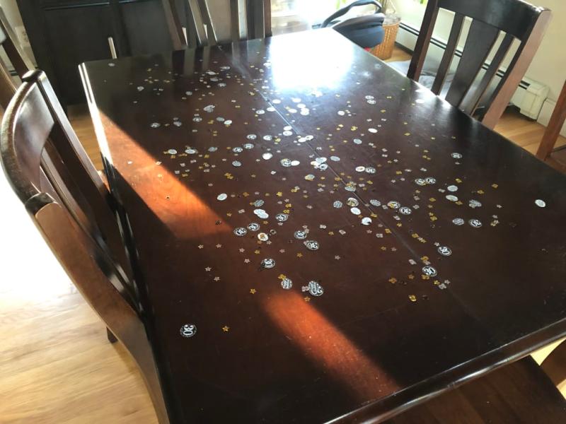 Confetti on the dining room table. Fun change from a table cloth.