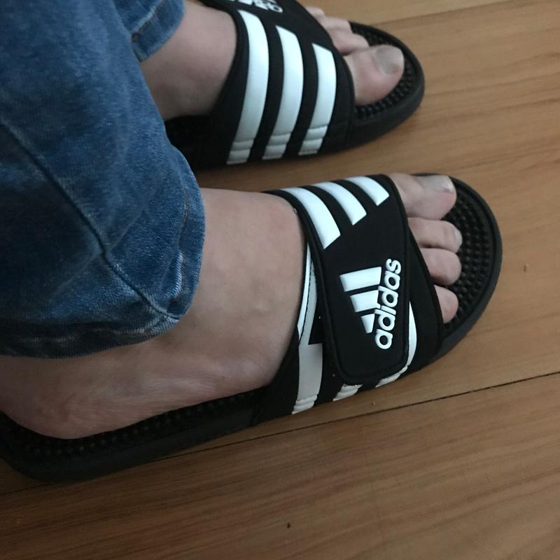 adidas slides on feet