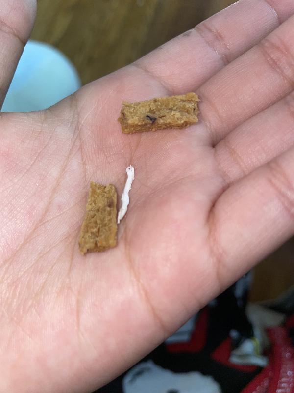 Piece of plastic almost as long as the treat itself.