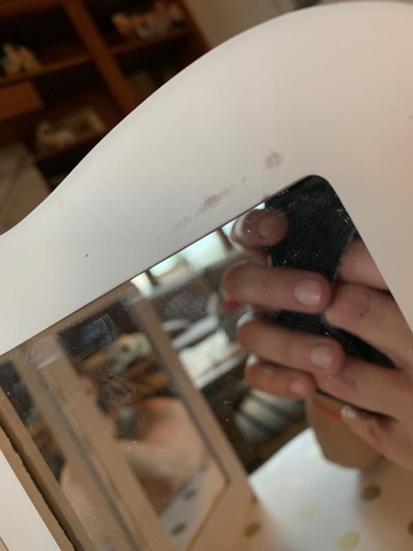 Scratch on the top of mirror - out of the box like this