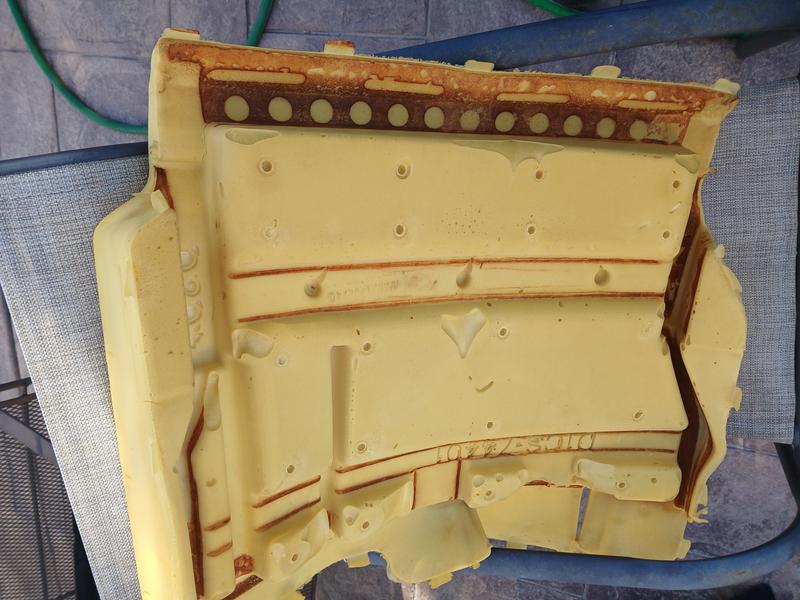 orange stains from leaked solution soaked into the foam.