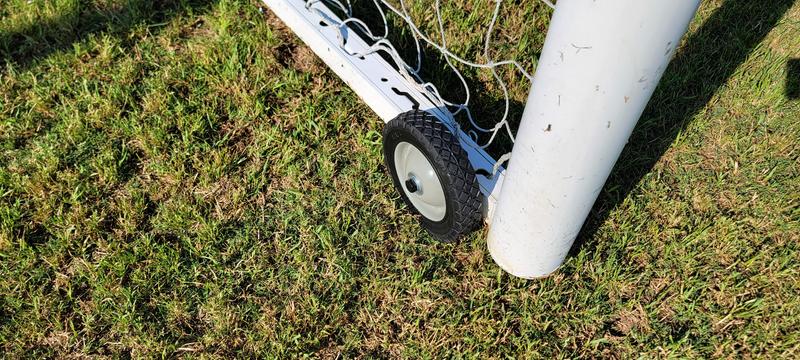 I drilled 1/2" holes through the aluminum soccer goal frame and added two washers and a cotter pin to make it easily removable. I did round off the threaded end of the bolts to get the balls from getting marred. I also primed and painted them.