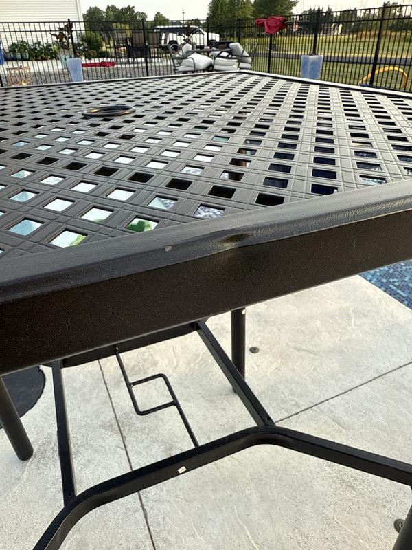 The table is dented. The chairs pieces are all misaligned.