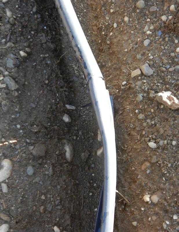 Expanded top for splice. Heated with torch and made round.