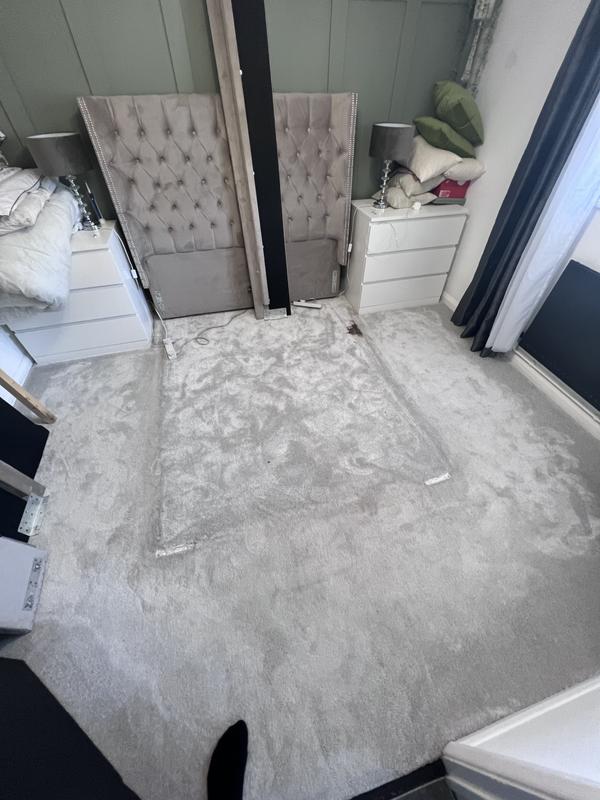 Bedroom carpet with a deep stain